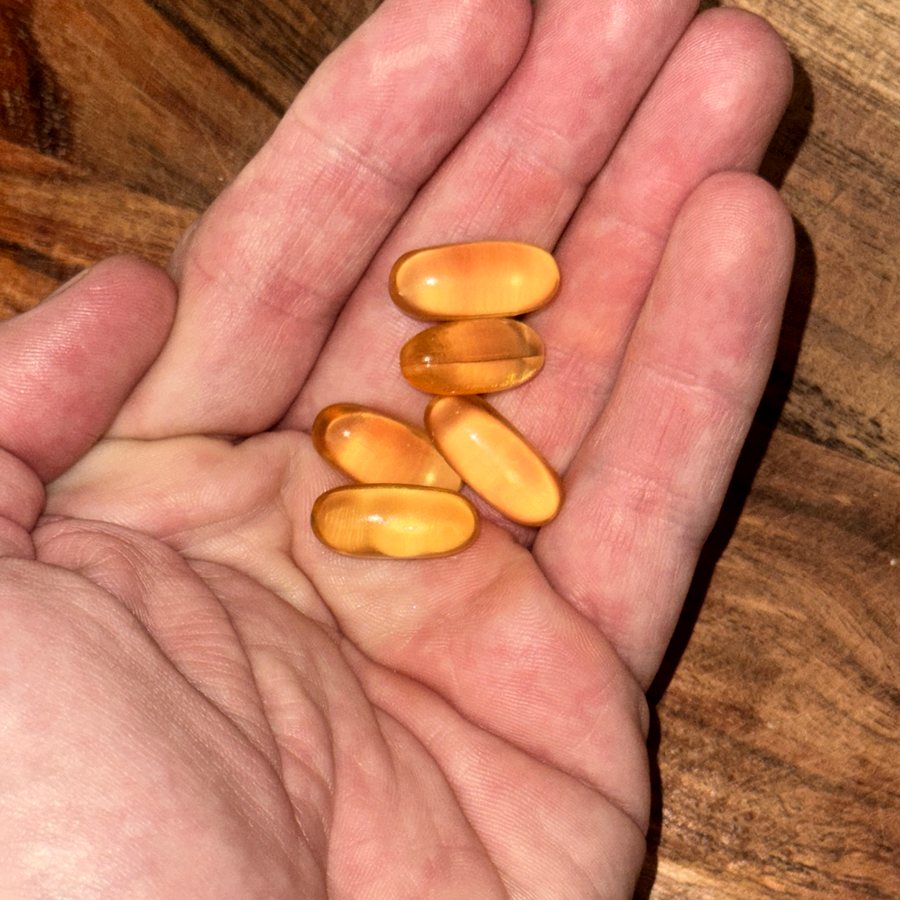 Omega softgels in hand